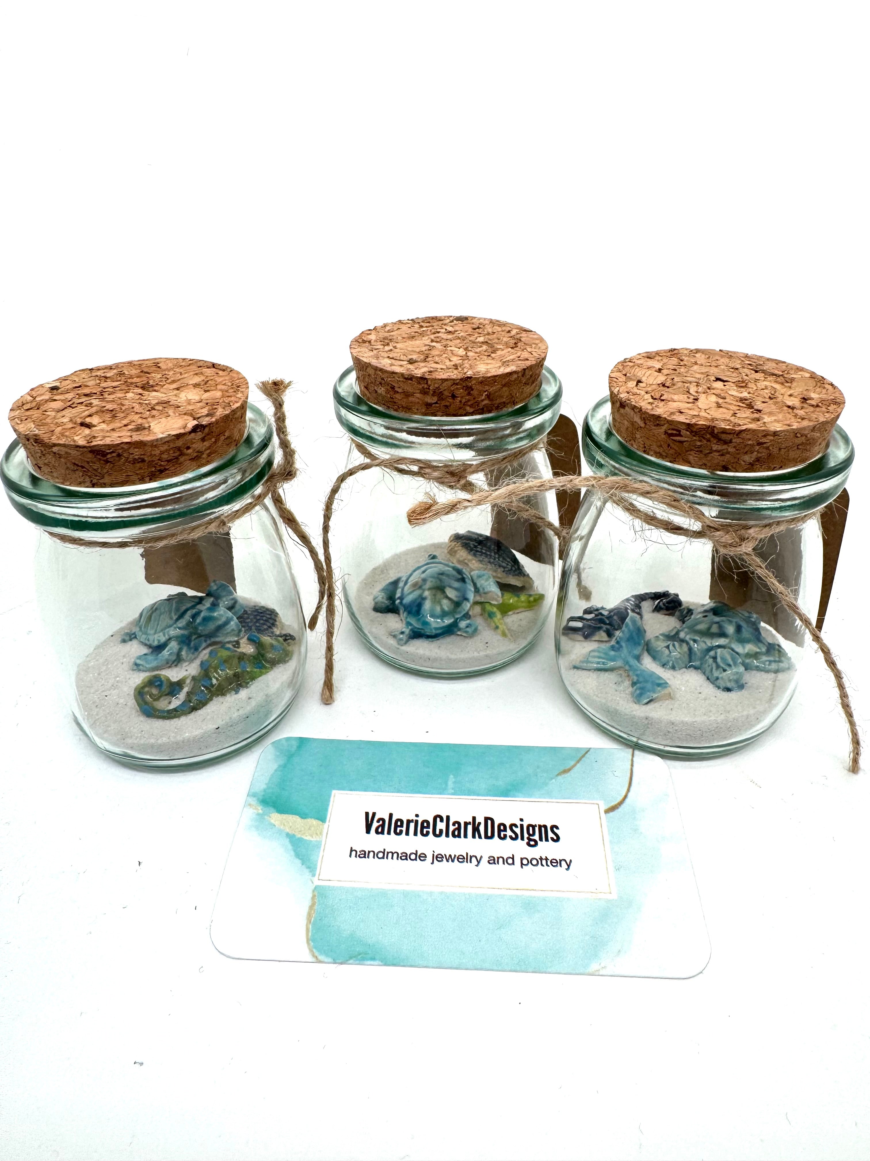 Glass mini bottles with mini beach pottery !